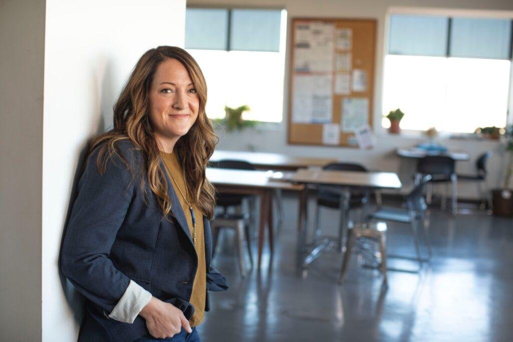 woman is standing in company