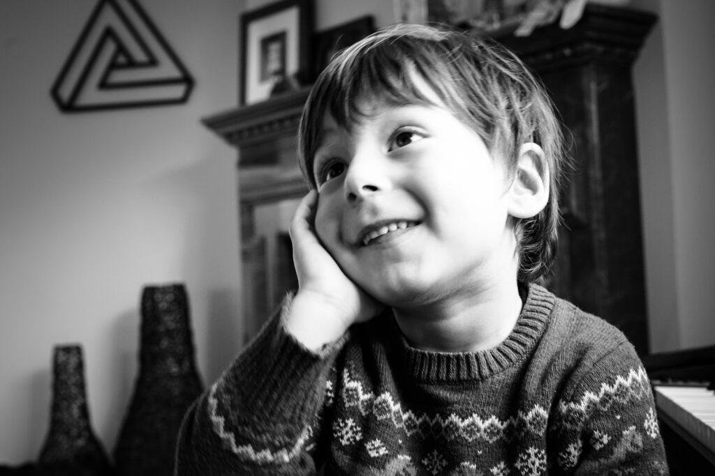 smiling boy and imagining something