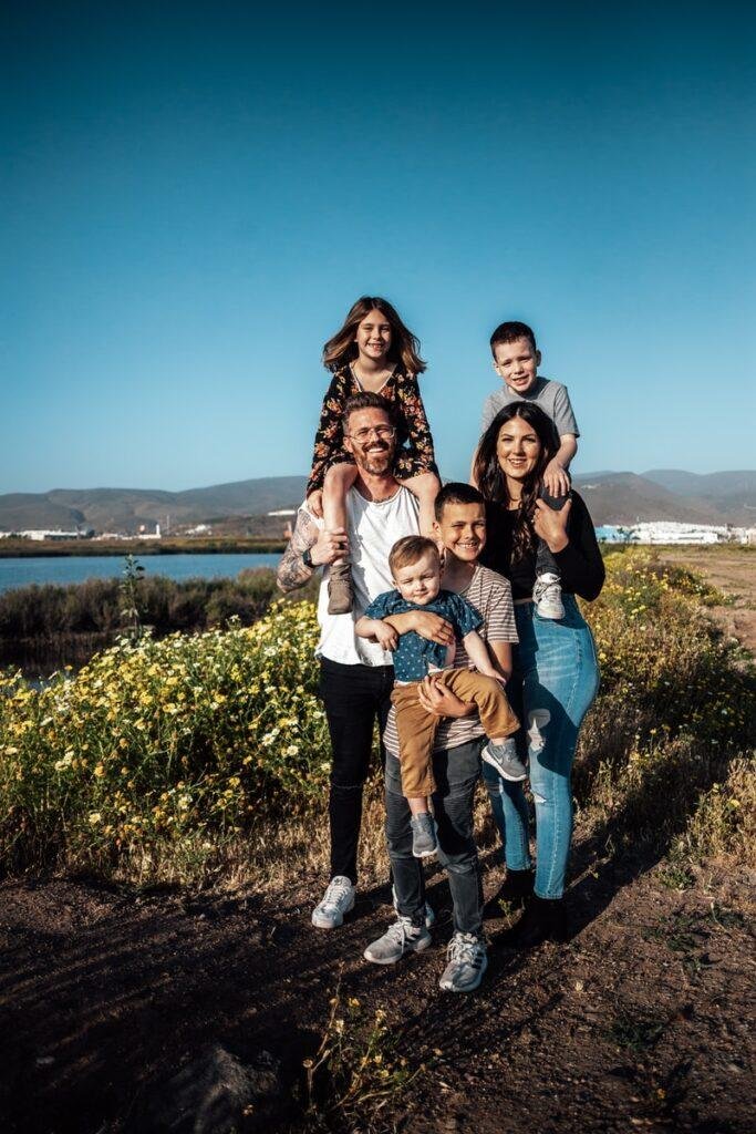 a family is standing at beach