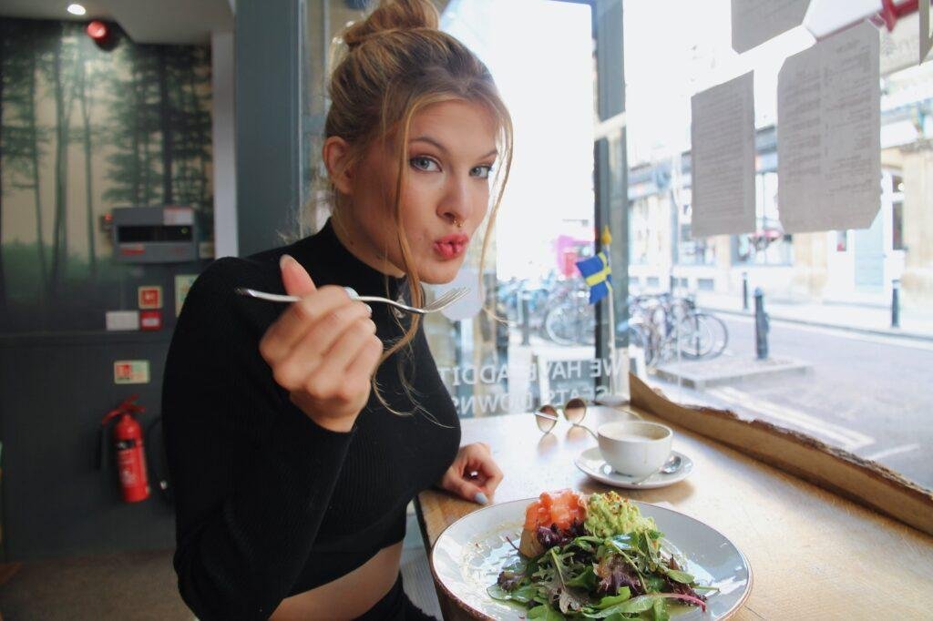 a girl is eating food