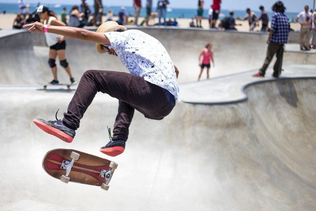 a boy is playing skateboard on skateboard park after exams