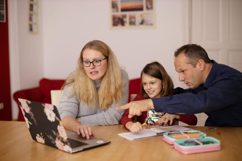 mom and dad are helping to their children to develop skills