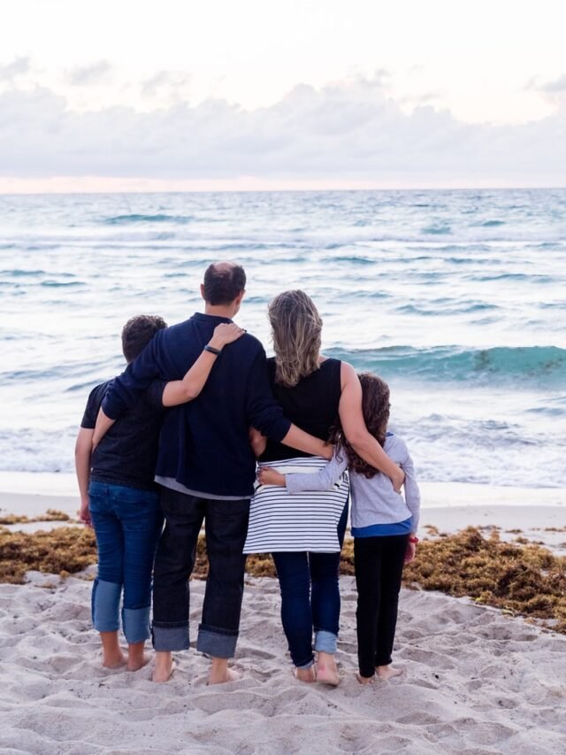 a family of four on a beach