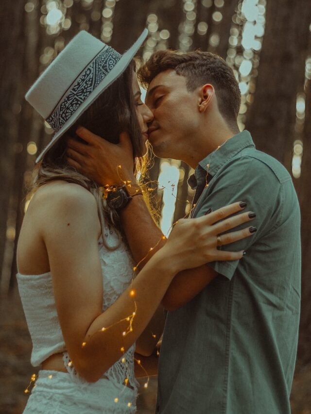 man kissing woman