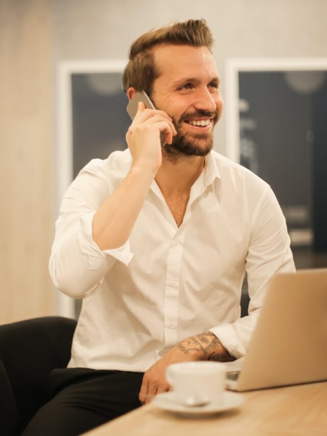 man using smartphone on chair