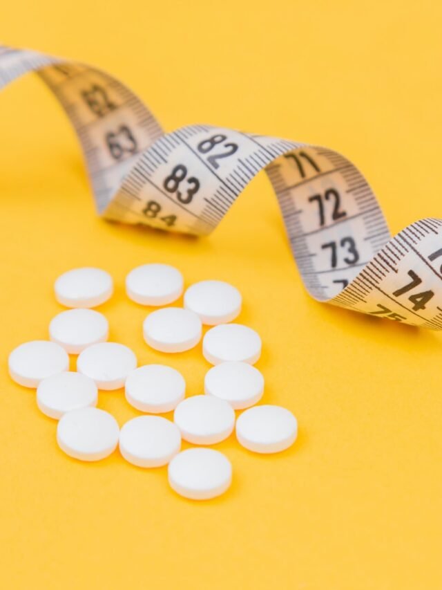 white round medication pill on yellow surface